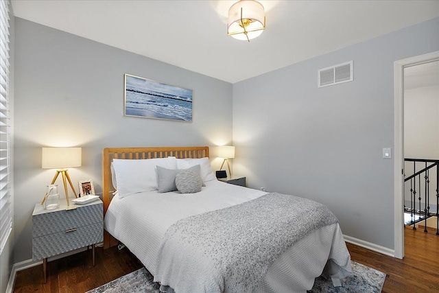 bedroom featuring dark wood-type flooring