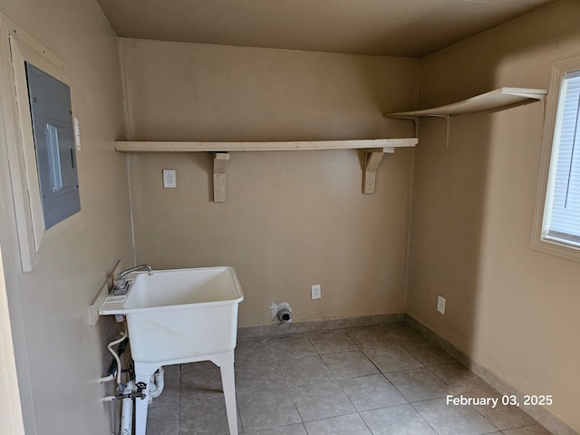 laundry room with electric panel and light tile patterned floors