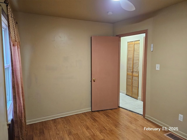 unfurnished bedroom with light wood-type flooring