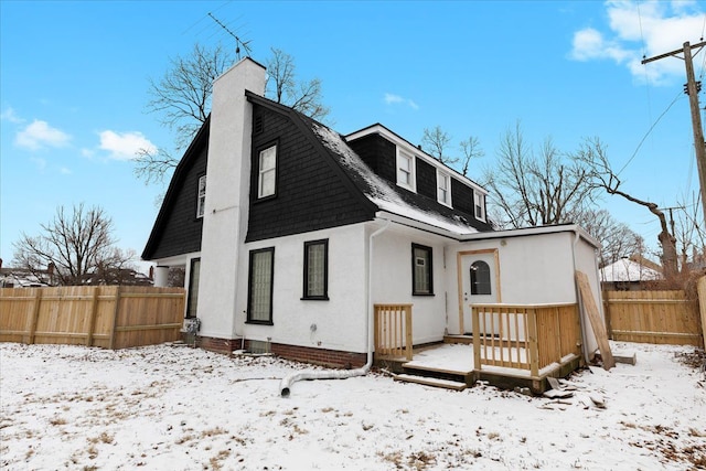 view of front of house featuring a wooden deck