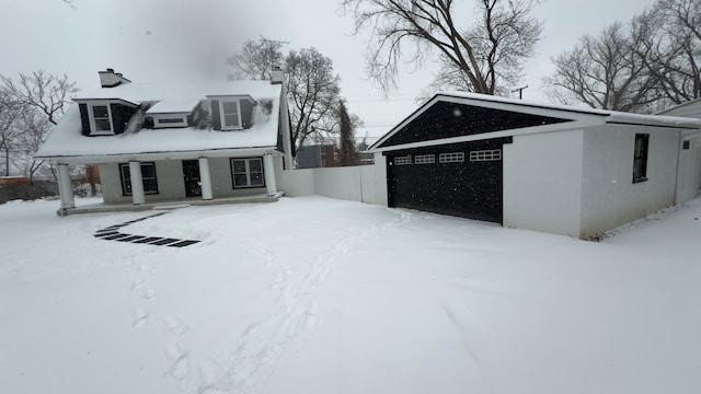 exterior space with cooling unit and a garage