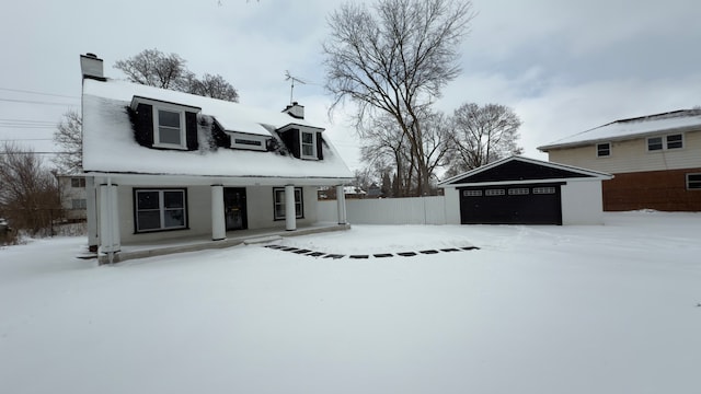 exterior space featuring covered porch and a garage