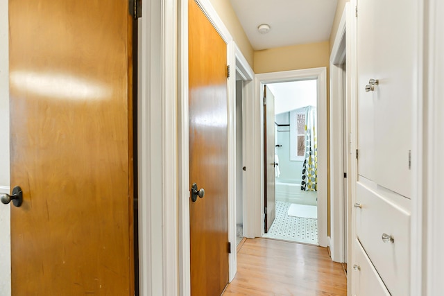 hallway with light wood-type flooring