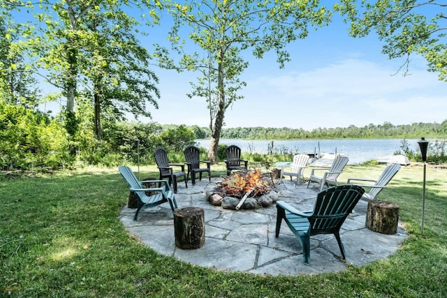 view of patio featuring a water view and an outdoor fire pit