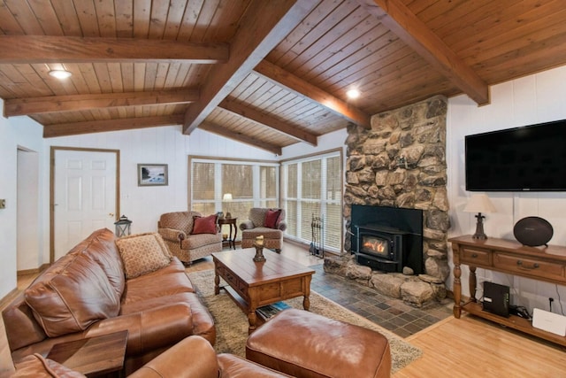 living room with vaulted ceiling with beams, wood-type flooring, wooden ceiling, and a fireplace