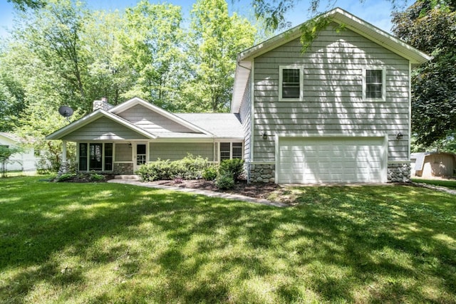 view of front facade with a porch, a garage, and a front yard