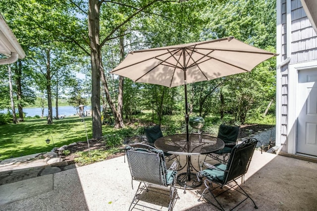 view of patio with a water view