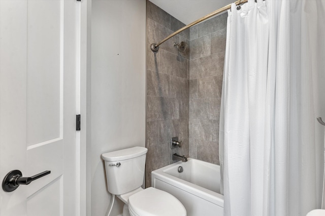 bathroom with toilet and shower / bath combo