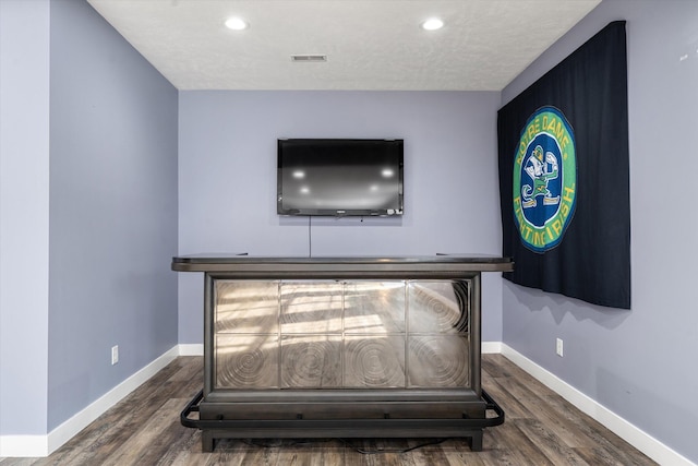 room details with wood-type flooring and a textured ceiling