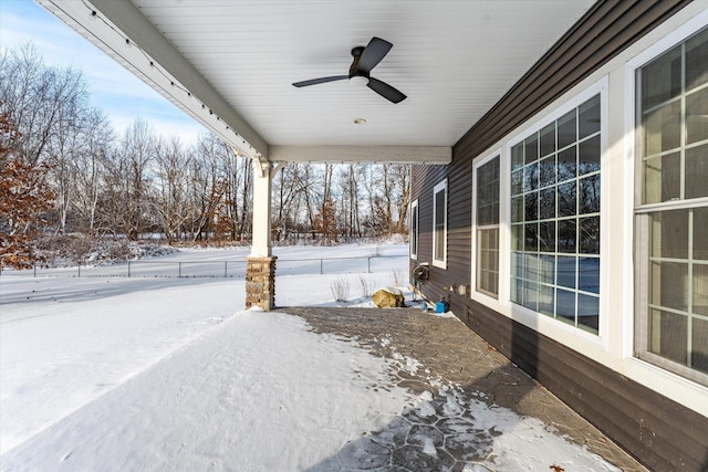 yard layered in snow with ceiling fan