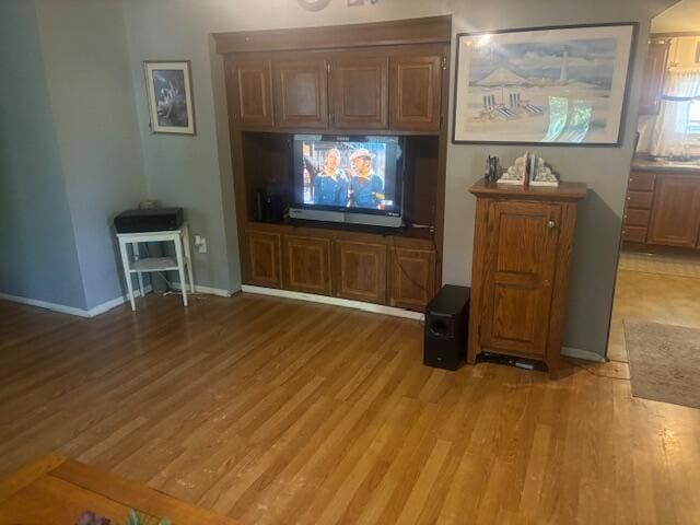 unfurnished living room with light wood-type flooring