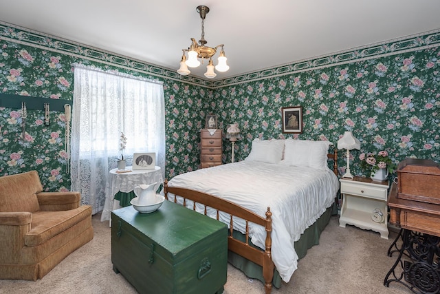 carpeted bedroom featuring a notable chandelier