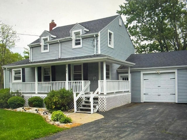 view of front of house featuring a garage and covered porch