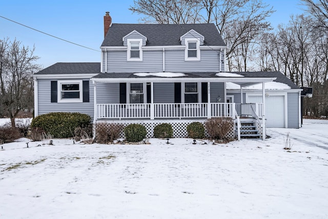 view of front of property featuring a garage and a porch