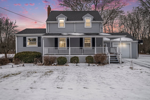 view of front facade with a garage and a porch