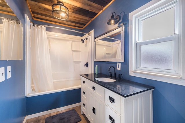 bathroom with vanity, wooden ceiling, and shower / bath combo with shower curtain