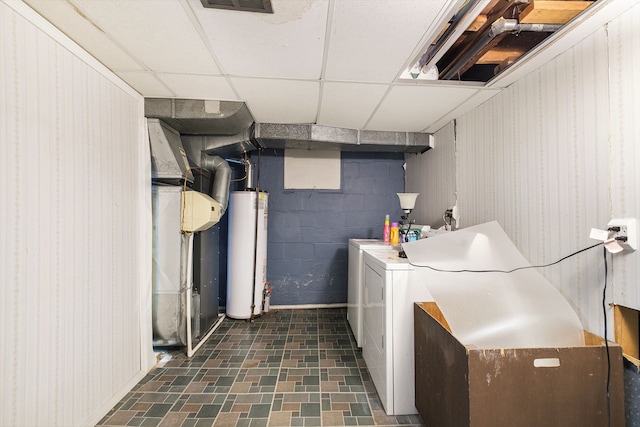 washroom with gas water heater and washing machine and clothes dryer