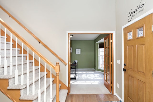 entryway with hardwood / wood-style floors