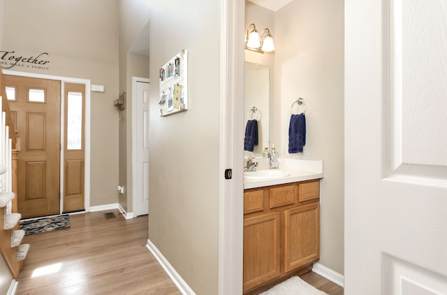 bathroom featuring vanity and wood-type flooring