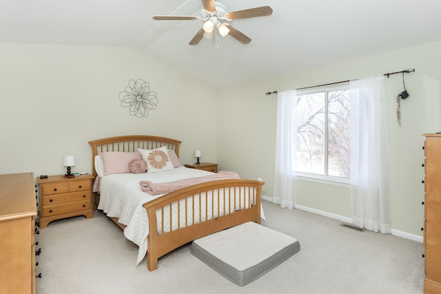 bedroom featuring lofted ceiling with beams, light colored carpet, and ceiling fan