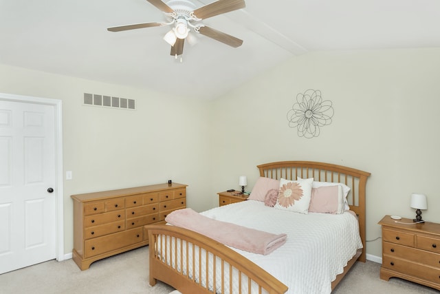 bedroom with lofted ceiling, light colored carpet, and ceiling fan