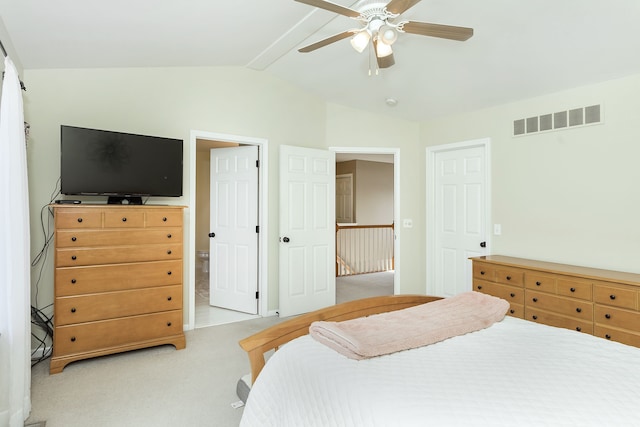 carpeted bedroom featuring ceiling fan and lofted ceiling with beams