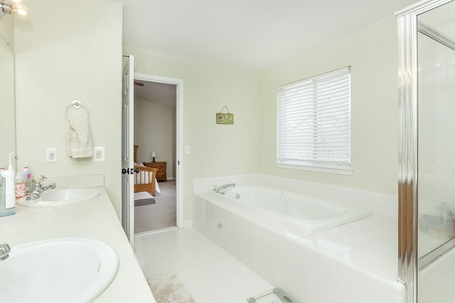 bathroom with vanity, tile patterned floors, and plus walk in shower