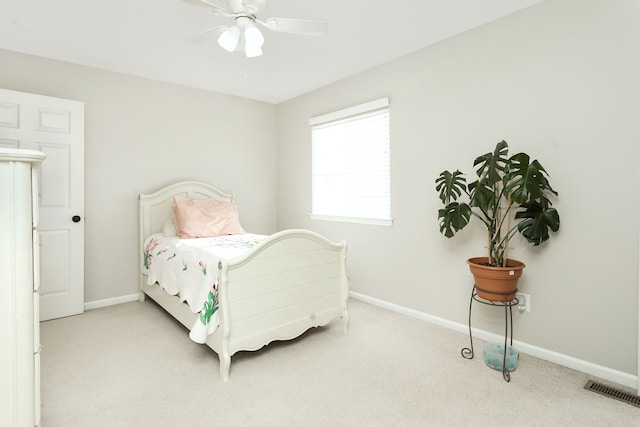 carpeted bedroom featuring ceiling fan