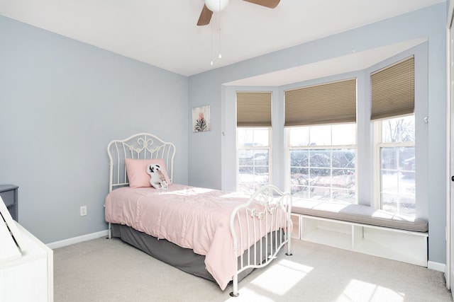 bedroom with light carpet and ceiling fan