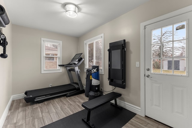 workout area featuring light hardwood / wood-style floors