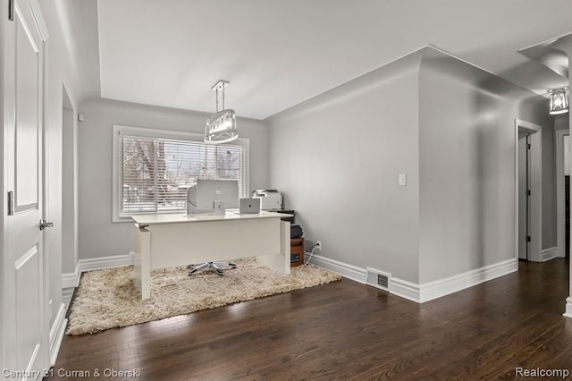 unfurnished office featuring dark wood-type flooring