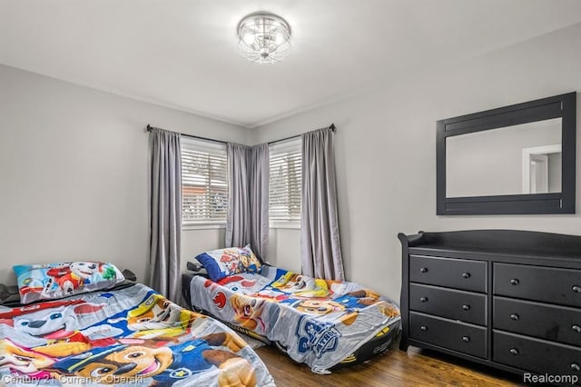 bedroom with hardwood / wood-style flooring