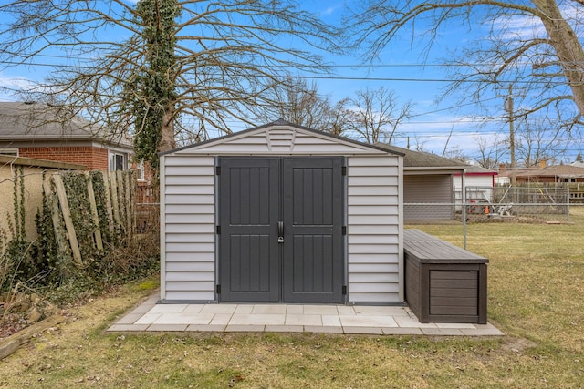 view of outbuilding with a lawn