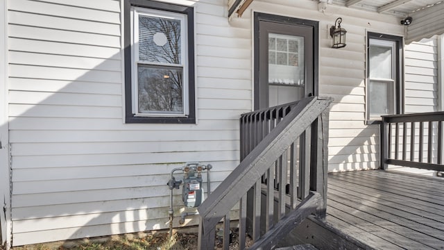 property entrance with a wooden deck