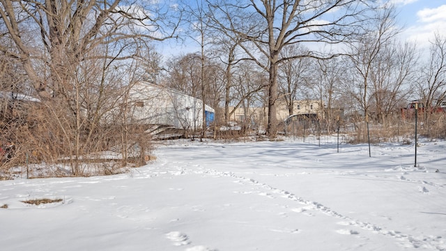 view of yard layered in snow