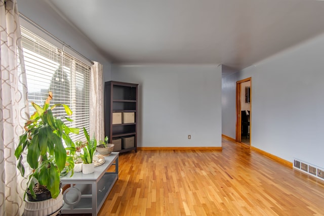 spare room with light hardwood / wood-style floors