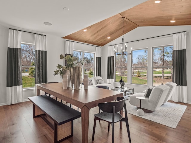 dining space featuring hardwood / wood-style flooring, recessed lighting, an inviting chandelier, wood ceiling, and vaulted ceiling