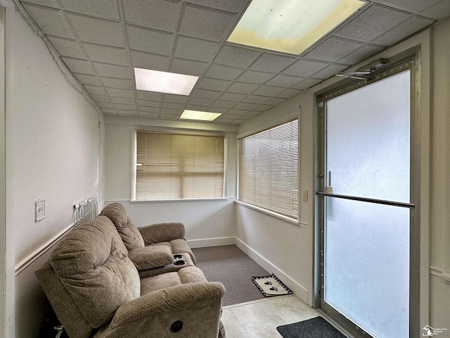 sunroom featuring a drop ceiling