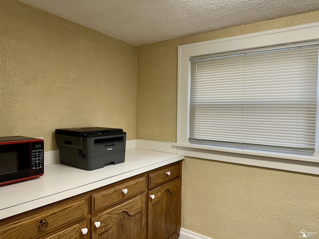 interior space featuring a textured ceiling