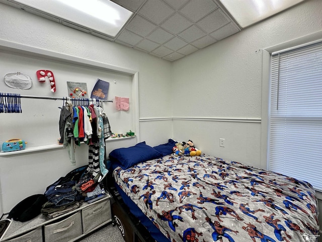 bedroom with a drop ceiling