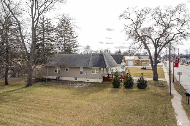 exterior space with a yard and central air condition unit