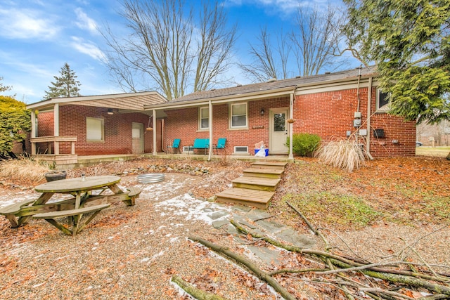 rear view of property featuring a patio area