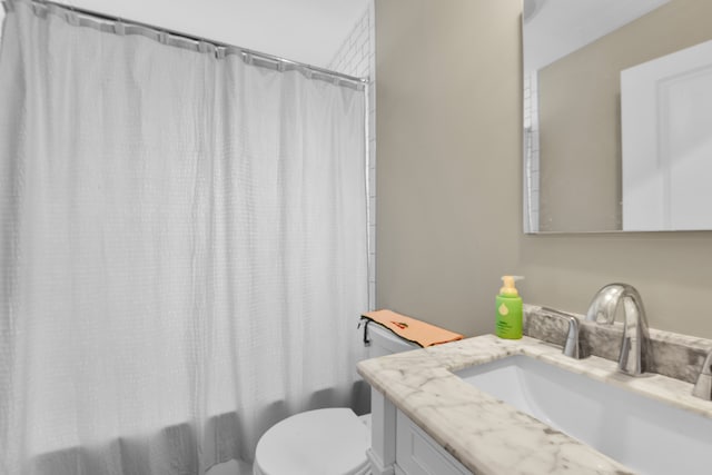 full bathroom with vanity, shower / bathtub combination with curtain, and toilet