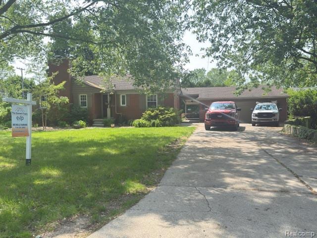 24530 Hickory Dr, Grosse Ile, MI 48138 - single story home featuring a front yard and a chimney
