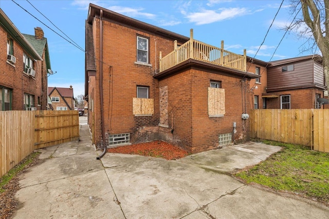 back of property featuring a balcony