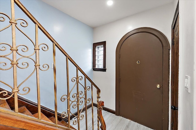 foyer entrance with light hardwood / wood-style flooring