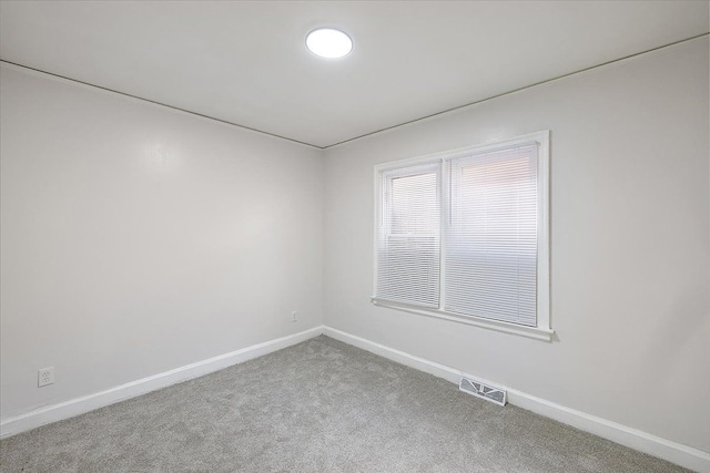 unfurnished room featuring carpet flooring