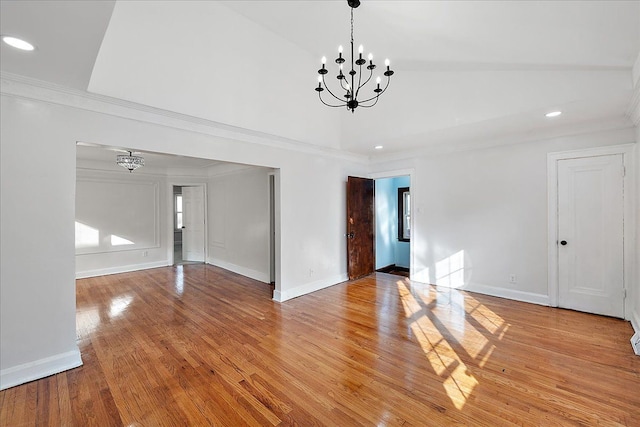 interior space featuring crown molding, a chandelier, and light hardwood / wood-style floors