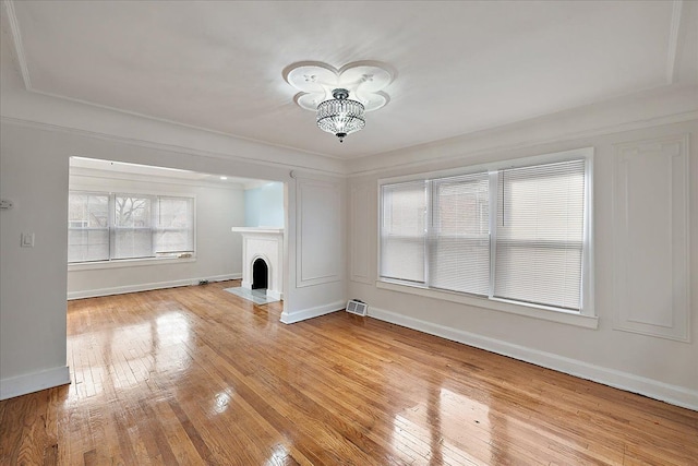 unfurnished living room with light wood-type flooring