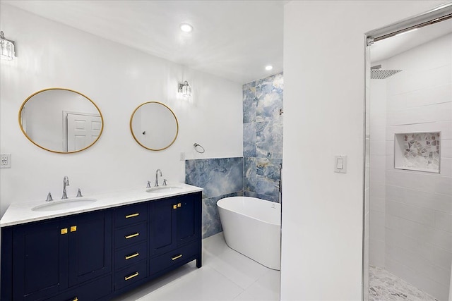 bathroom with tile walls, vanity, and separate shower and tub